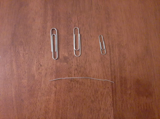 Bend the paperclip How To Remove A Keycap Off Of A Mechanical Keyboard Without A Tool