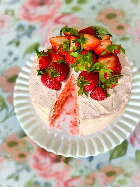 Fresh Strawberry Cake with Strawberry Buttercream Frosting, the ultimate Southern dessert for any special occasion, or just for a delightful dinner with family.  Fresh juicy strawberries take center stage in this show-stopping strawberry cake and buttercream frosting.