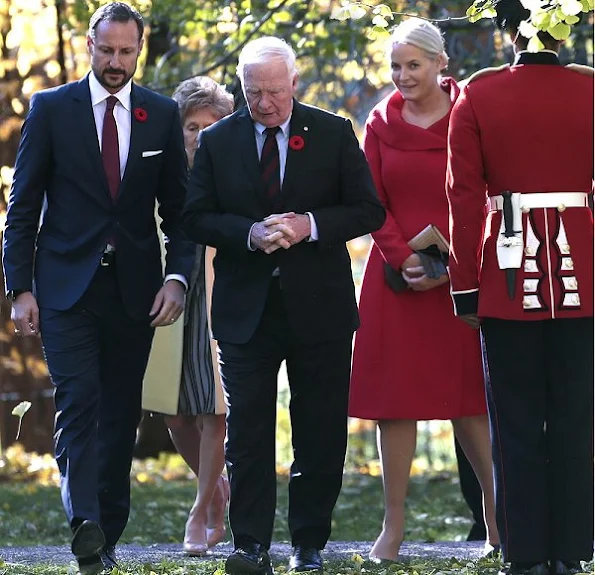 Crown Princess Mette-Marit wore Alexander Mcqueen Dress Coat, Gianvito Rossi pumps, clutch bag, pearl gold earrings