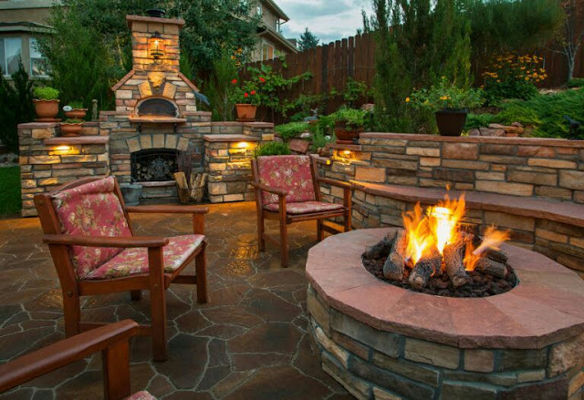 covered outdoor living spaces with fireplace