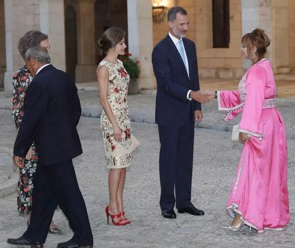 King Felipe and Queen Sofia at Almudaina Palace. Queen Letizia wore a malina print dress and Magrit shoes