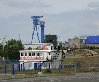 Rosyth Castle hidden amongst construction site buildings and Rosyth Dockyard.  Photo by Kevin Nosferatu for the Skulferatu Project
