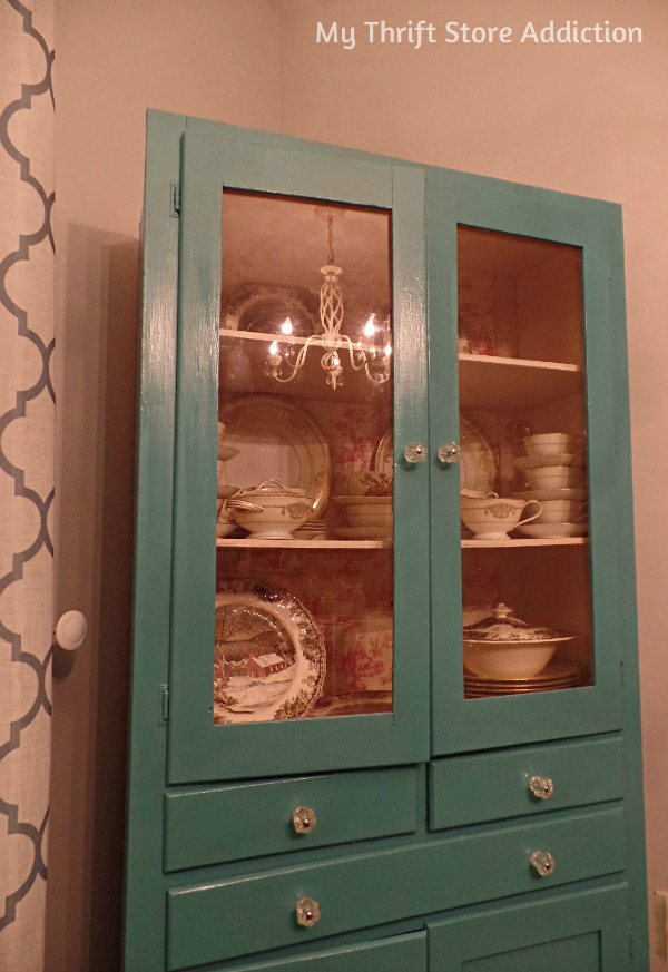 How to Transform Shelves with Thrift Store Paper mythriftstoreaddiction.blogspot.com China cabinet makeover using thrift store draw liners and removing cabinet doors.