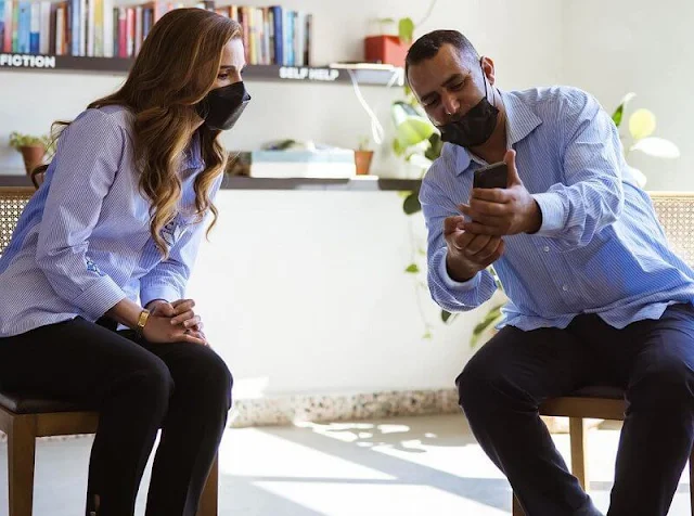 Queen Rania wore a blue embroidered design, striped, long sleeve blouse shirt from Maison Makarem, black denim trousers