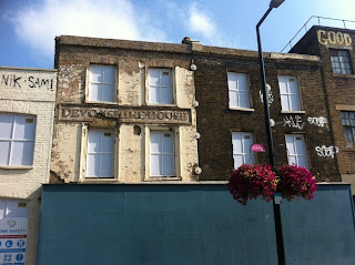 Old sign, Devonshire House, in Flat Iron Square, London, SE1