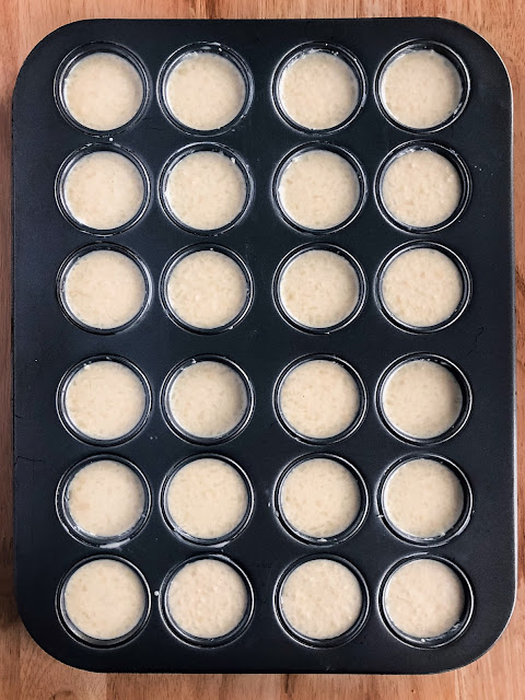 mini muffin tray with batter