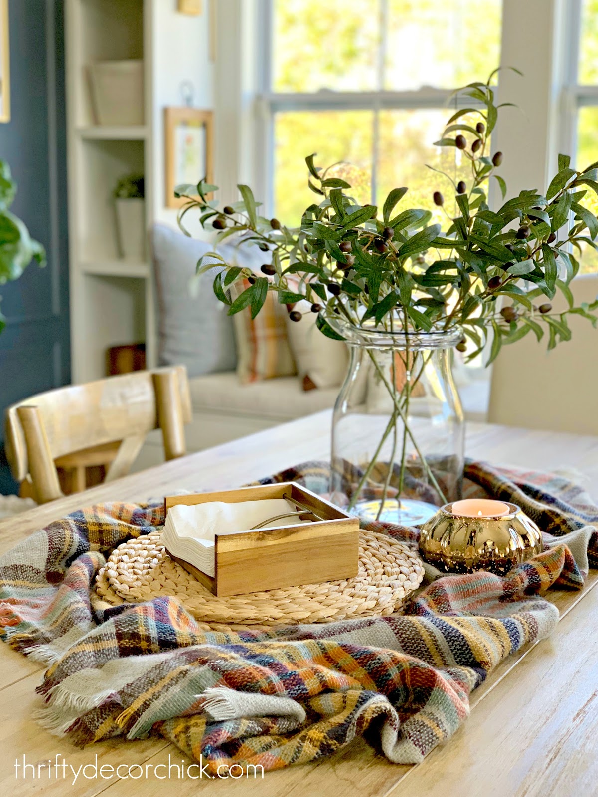 Fall table arrangement with olive stems