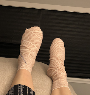 Week 1 - sent home in bandaged feet