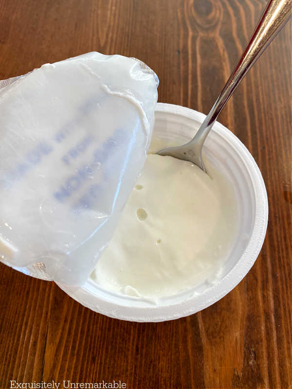 Plain yogurt container with spoon