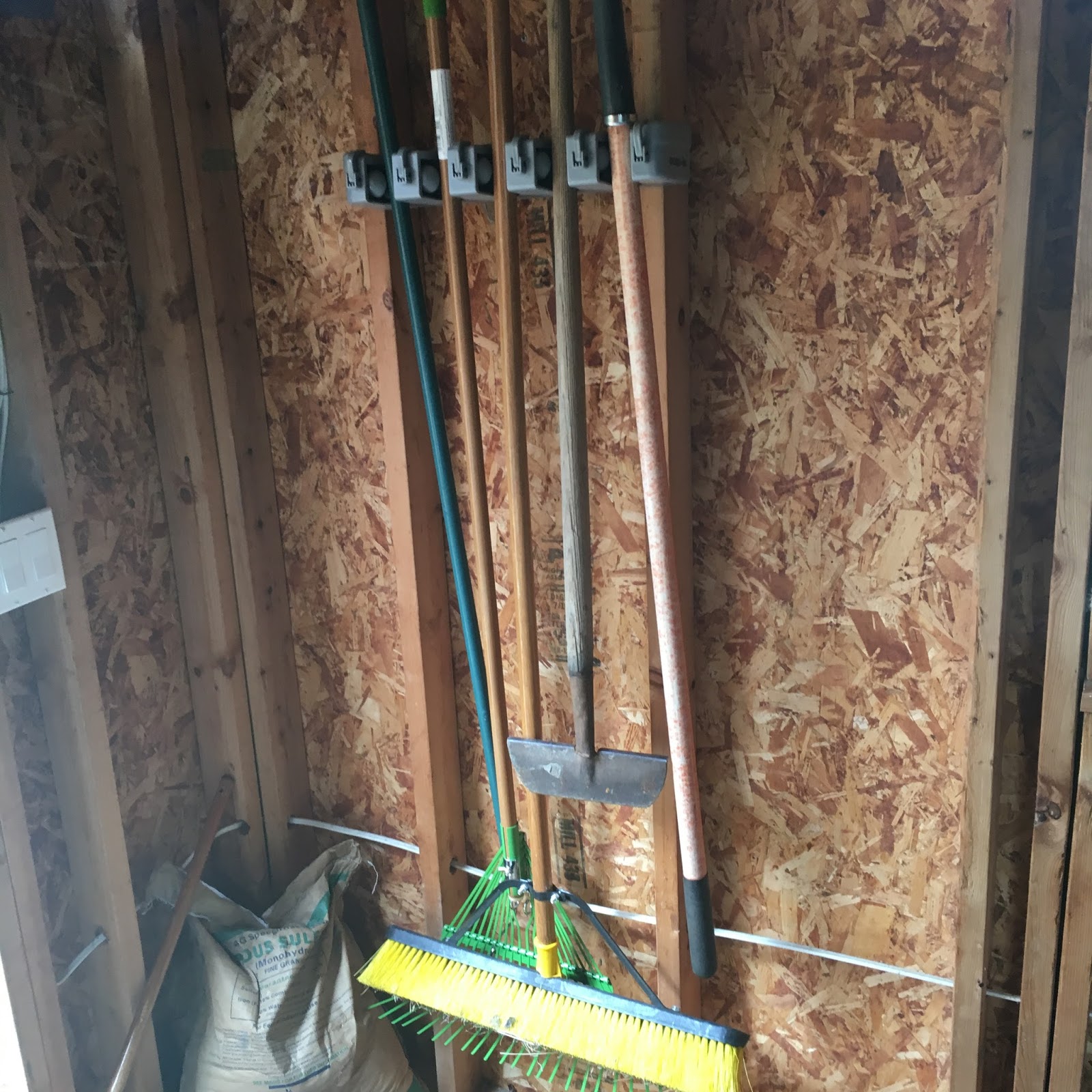 Mom Reviewing The Amazing Mop and Broom Holder