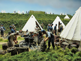 Diorama of 19th-century soldiers at an encampment.