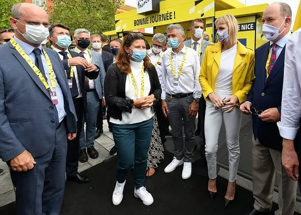 Princess Charlene wore a leather biker full color yellow jacket by Philipp Plein, and white blouse and trousers by Roland Mouret