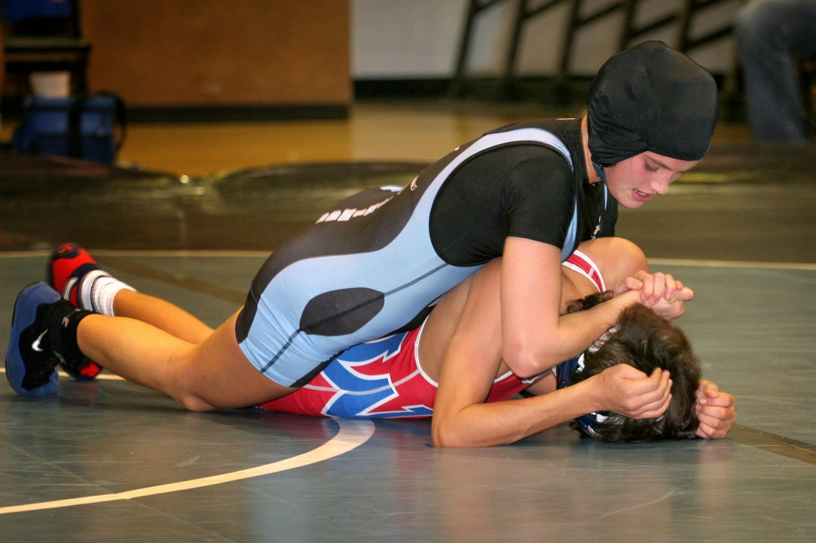 Men Wrestling Women: girl wrestler racks up victories.