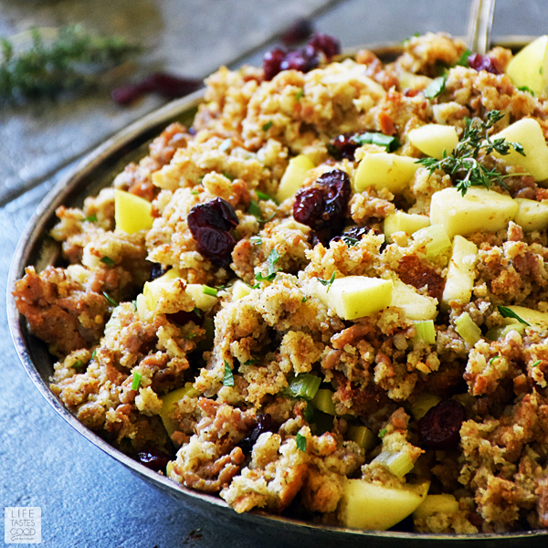 Sausage Apple and Cranberry Stuffing recipe in a silver serving dish ready to eat