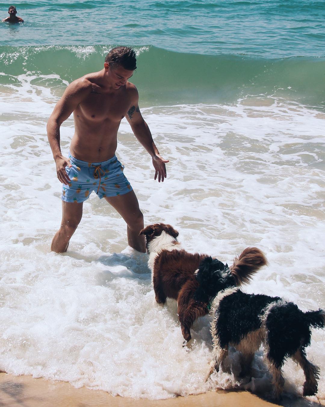 hot-guys-playing-dogs-pets-ocean-wet-water