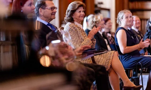 Queen Silvia wore a tweed jacket and skirt by Chanel, Chanel tweed cropped scarf in magenta and Zara tweed jacket and skirt