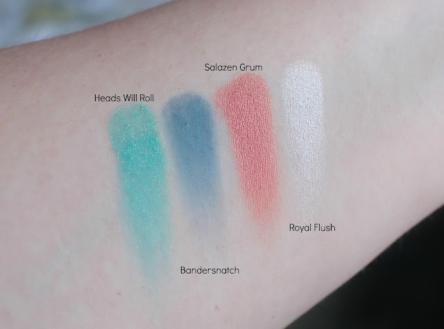 Photo of swatches of The Red Queen Shades from the Urban Decay Alice Through the Looking Glass Palette
