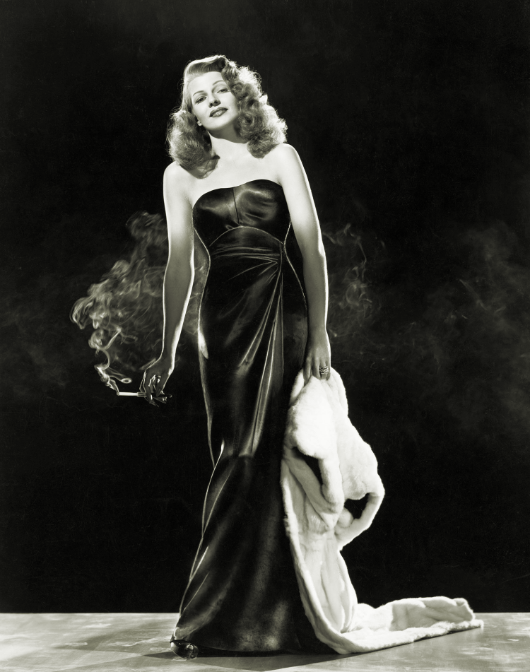 Designer Jean Louis puts coat on Rita Hayworth PHOTO From Original Negative