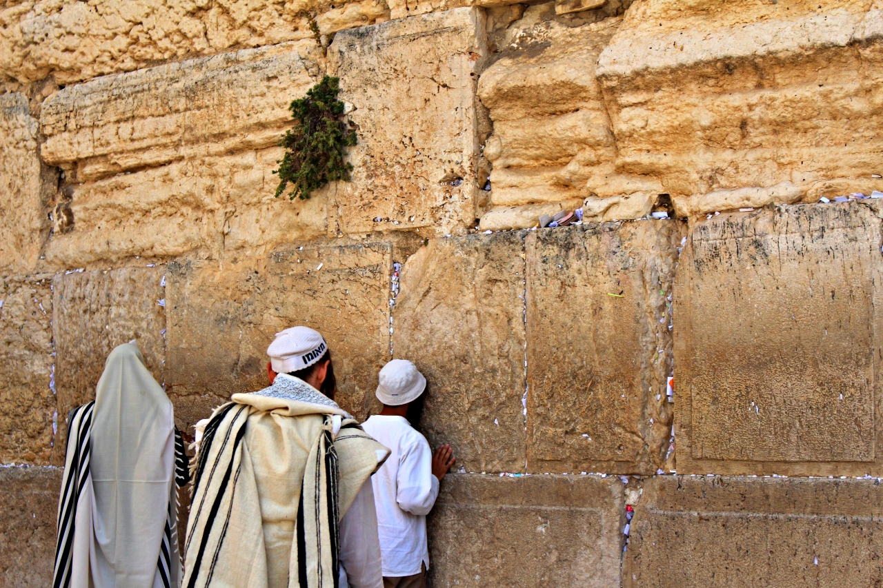 Reciting a Brief Prayer at the Wailing Wall in Jerusalem Israel