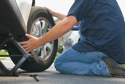 changing flat tyre