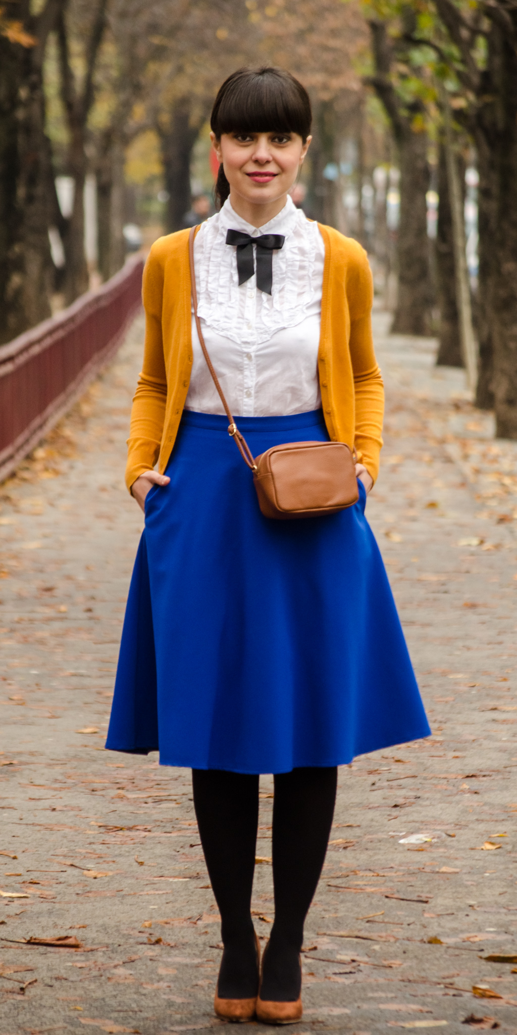 preppy school outfit mustard sweater cobalt blue skirt brown high heels brown satchel h&m c&a poema