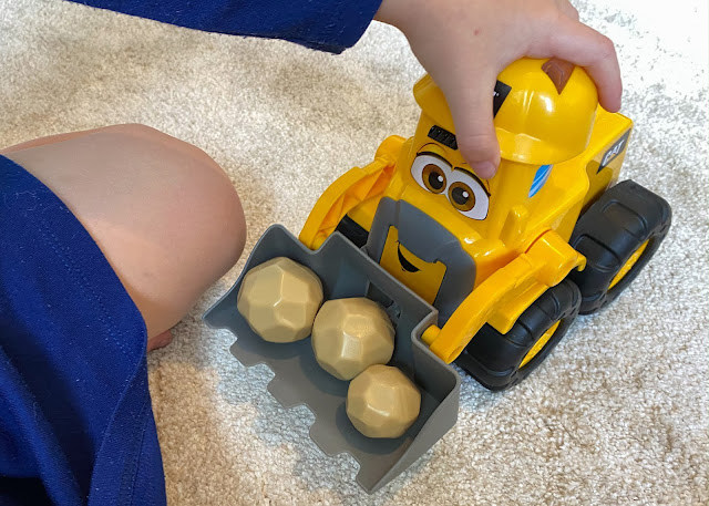 Playing with the construction buddy toy Moving the construction buddy wheel loader around