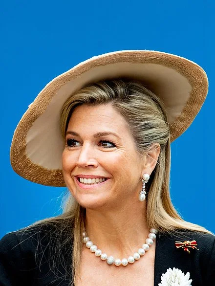 Queen Maxima wore Matthijs van Bergen Coppens Lelies jacket and floral print skirt