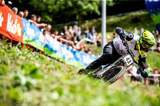 Eyes on the apex Jack Reading racing downhill MTB focusing on the next turn.