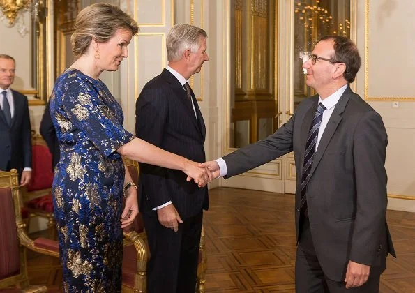 Queen Mathilde wore Dries Van Noten A-Line metallic floral jacquard midi dress. European Union, and the foreign diplomats