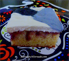 Raspberry Swirl Halloween Cake, a moist white raspberry swirled cake with fluffy vanilla frosting, decorated for Halloween | Recipe developed by www.BakingInATornado.com | #recipe #cake #Halloween