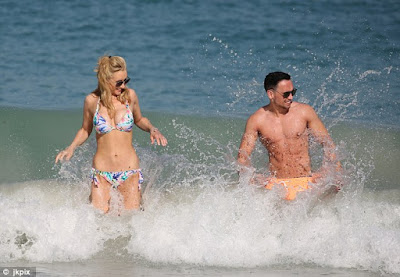 Catherine Tyldesley flaunts her flat tummy and curves in printed bikini on honeymoon with husband Tom Pitfield
