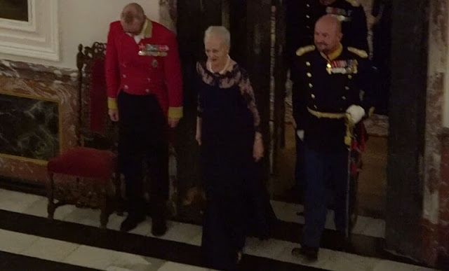 Crown Princess Mary wore the official uniform worn by Danish female navy officers. Queen Margrethe wore a lace tulle gown
