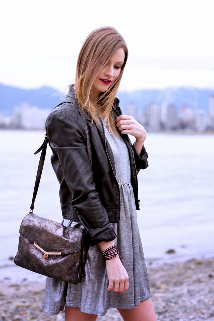 Vancouver Fashion Blogger, Alison Hutchinson, is wearing a MinkPink silver dress, Forever 21 leather jacket, Topshop western boots, botkier valentina bag, and a privilege clothing bracelet