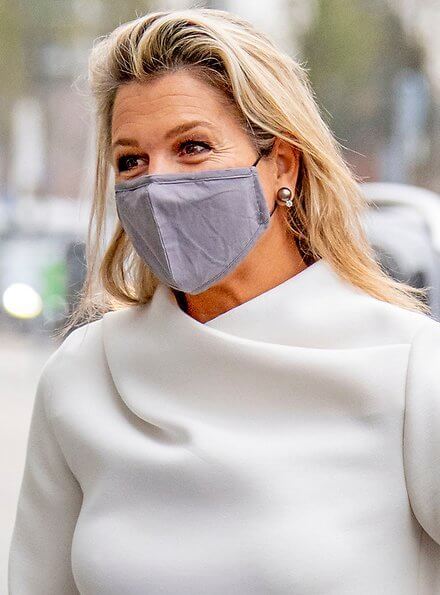 Queen Maxima wore a white silk top from Natan, and grey suede pumps from Gianvito Rossi, and the queen carried grey bag from Chanel