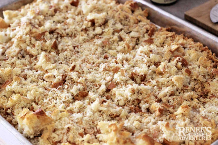 Sage and Onion Stuffing bread crumbs toasted in oven sitting on a sheet pan