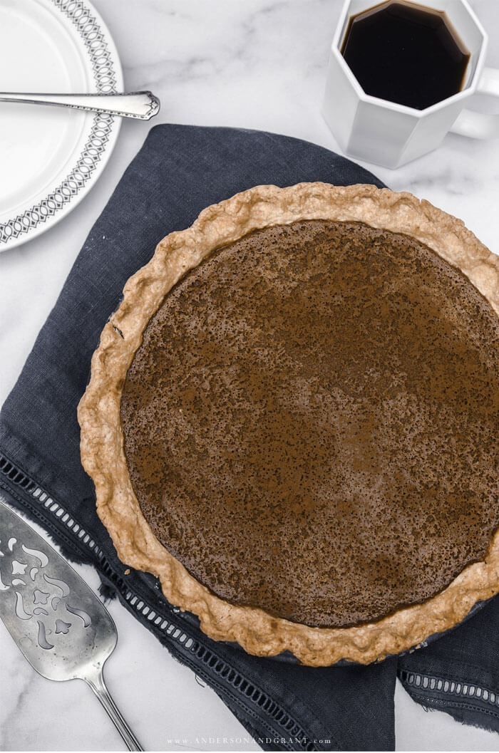 Whole apple butter pie with coffee This creamy Apple Butter Pie is a must have recipe to add to your fall collection.