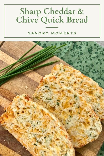 Slices of baked cheddar and chive quick bread.