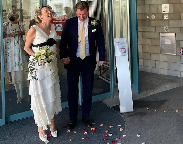 Tessy Antony wore a white ruffled wedding gown with a black belt, she accessorised with a diamond necklace and earrings