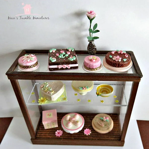quilled miniature baked goods and flowers