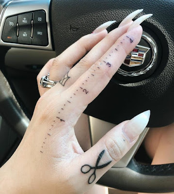 Ruler finger tattoo