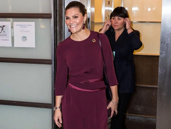Crown Princess Victoria wore Andiata Kamille trousers and kiana blouse in burgundy, and Odnala wool coat in pink