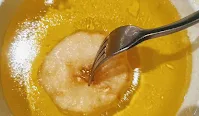 Soak pineapple jalebi into sugar syrup for pineapple jalebi recipe