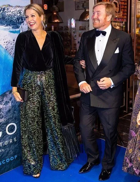 Queen Maxima wore a velvet top and metallic trousers as she joins husband at a film premiere in Amsterdam