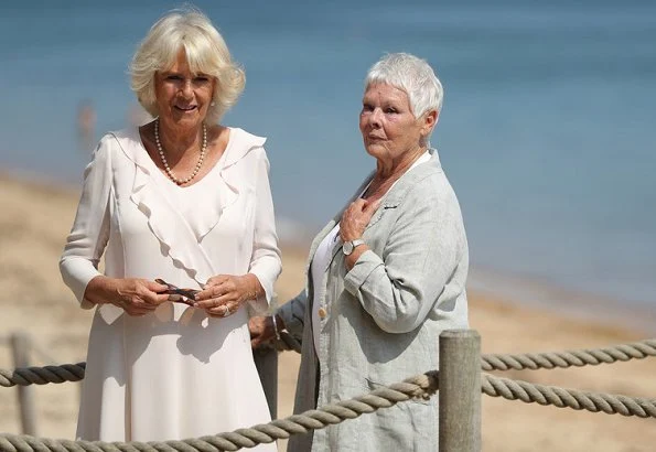 The Duchess of Cornwall was welcomed by Dame Judi Dench – the patron of the Friends of Osborne and curator of Osborne House, Michael Hunter