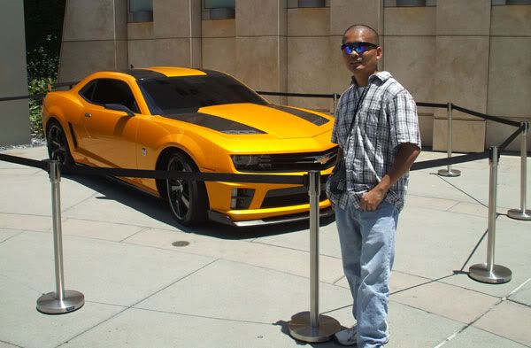 Posing in front of the Chevy Camaro that represents Bumblebee in TRANSFORMERS: DARK OF THE MOON.