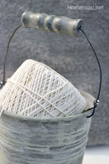 Metal patina bucket with a handle and ball of string