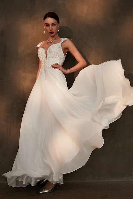 gorgeous A-line white wedding dress with beaded top