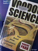 Voodoo Science, by Robert Park, superimposed on the cover of Intermediate Physics for Medicine and Biology.