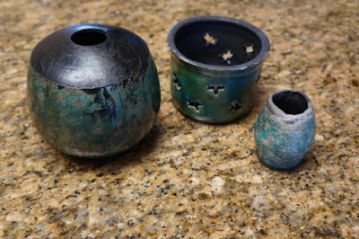 Glazed raku pottery pots / vessels / vases, including a candleholder.