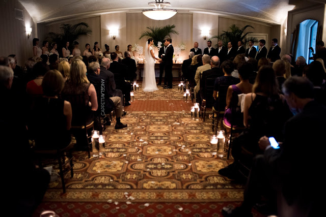 A NY Athletic Club wedding includes a very intimate ceremony in a candle lit room.